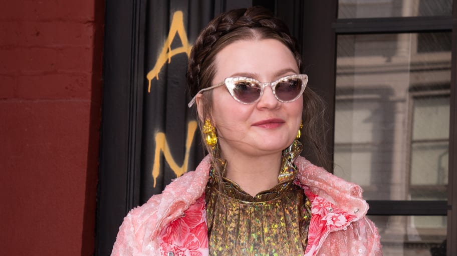 Anna Sorokin in sunglasses and a pink coat 