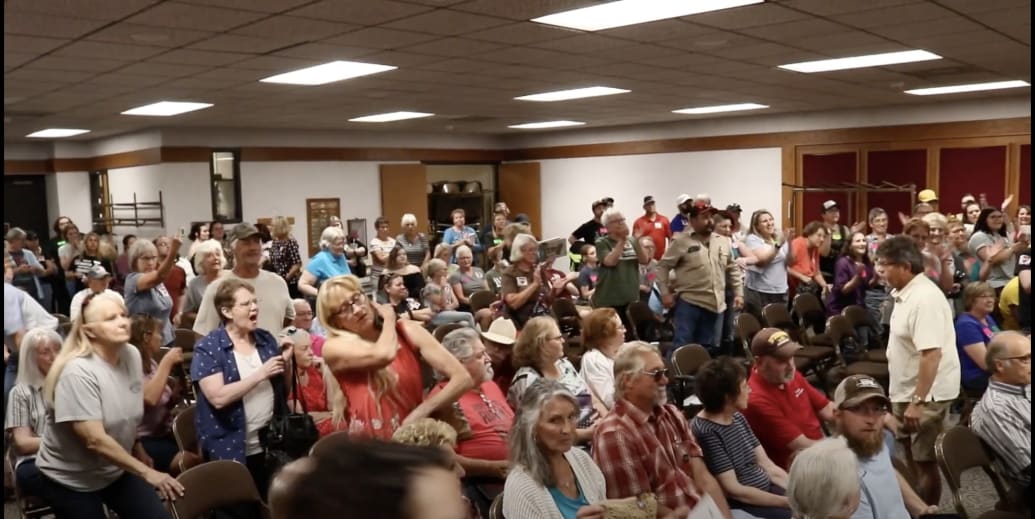 The crowd reacts after a July 28 meeting of the Campbell County Library Board ousted Terri Lesley.