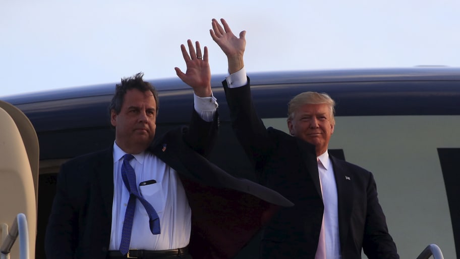 U.S. Republican presidential candidate Donald Trump arrives with Gov. Chris Christie (R-NJ) at a campaign rally at Winner Aviation in Youngstown, Ohio