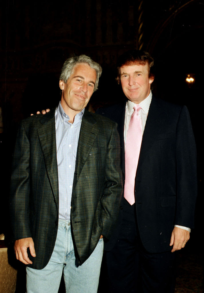 Jeffrey Epstein and Donald Trump pose at Mar-a-Lago in 1997.