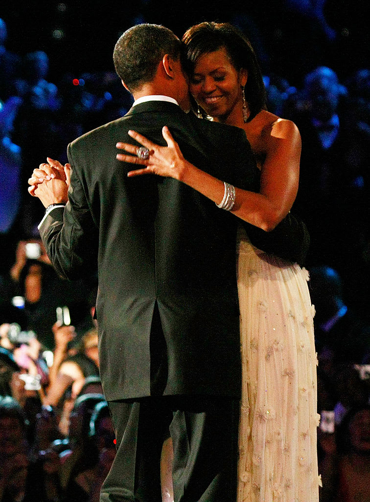 U.S. President Barack Obama dances with his wife and First Lady Michelle Obama, who is wearing Jason Wu, at the first Inaugural Ball in 2009.