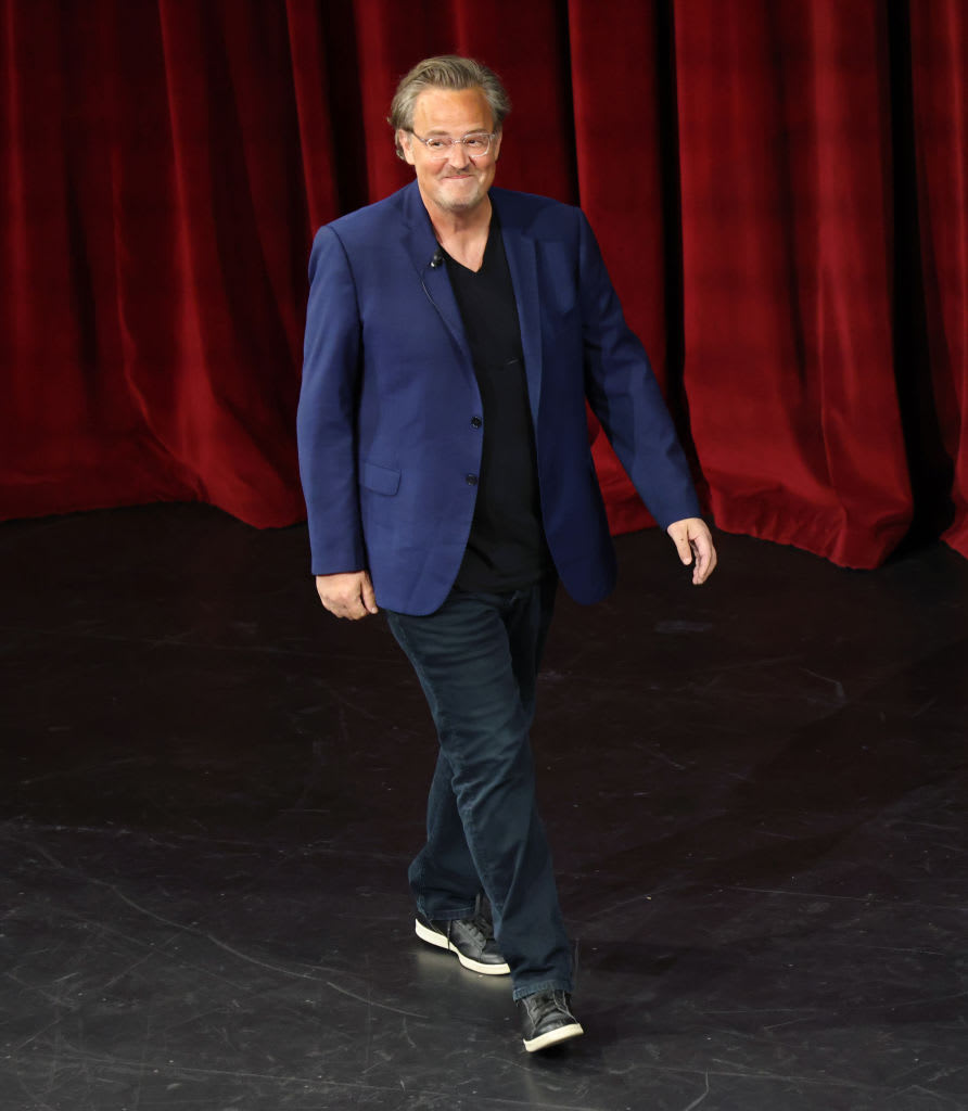 Matthew Perry walks onstage at the LA Times Festival of Books in 2023.