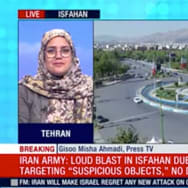 Press TV presenter smirking at the Israeli attack on Iran.