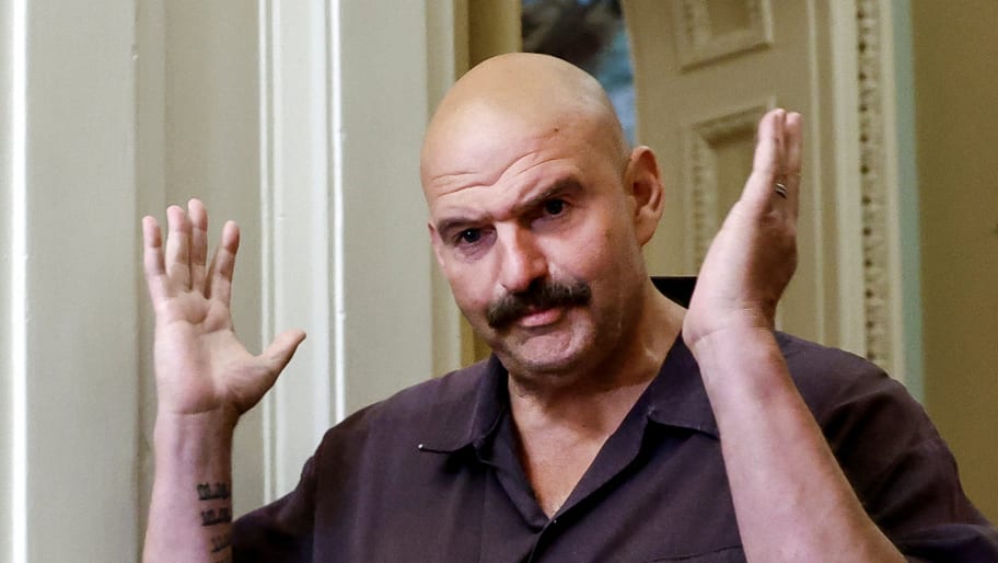 U.S. Senator John Fetterman (D-PA) gestures towards the media, before the weekly Democratic policy luncheon
