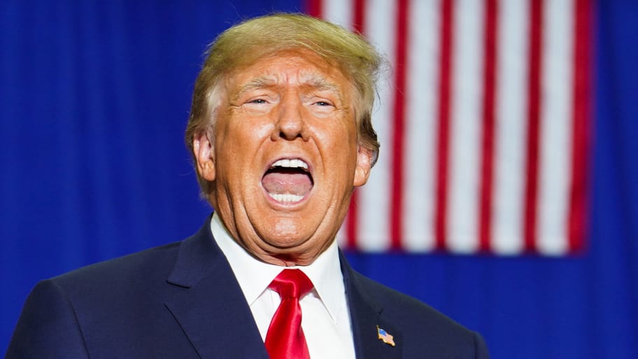 Donald Trump reacts as he attends a rally in Warren, Michigan, Oct. 1, 2022.