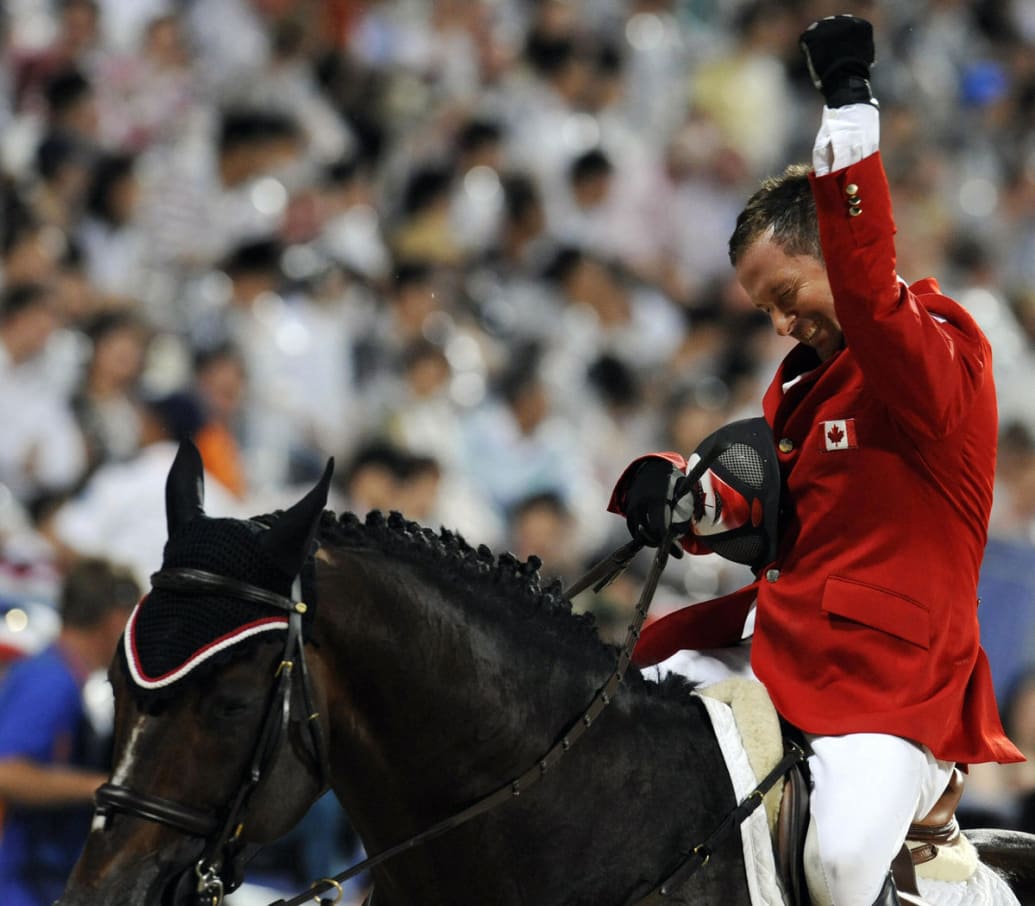 Eric Lamaze, riding Hickstead, celebrates after winning gold in the 2008 Olympic Games.