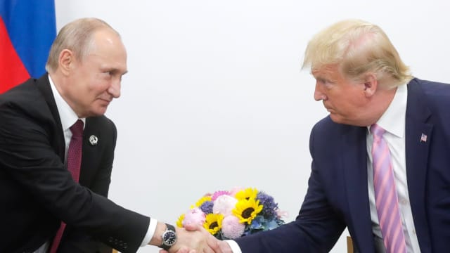 Former President Donald Trump and Russian President Vladimir Putin shake hands at G20 summit. 