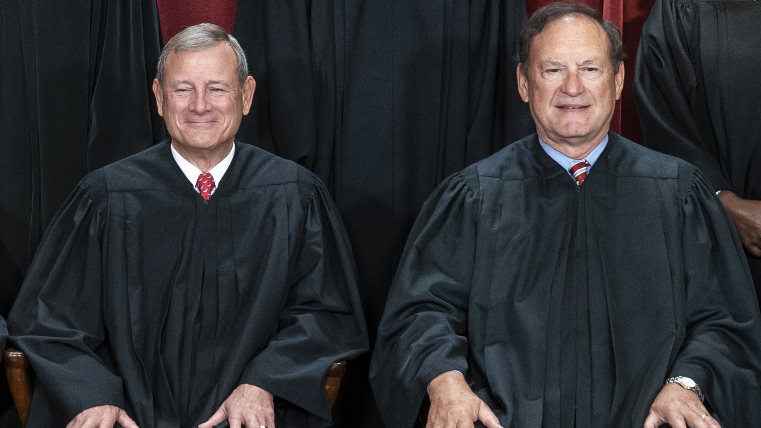 Chief Justice of the United States John Roberts, left, and Associate Justice Samuel Alito, right, seated together for a photo. 