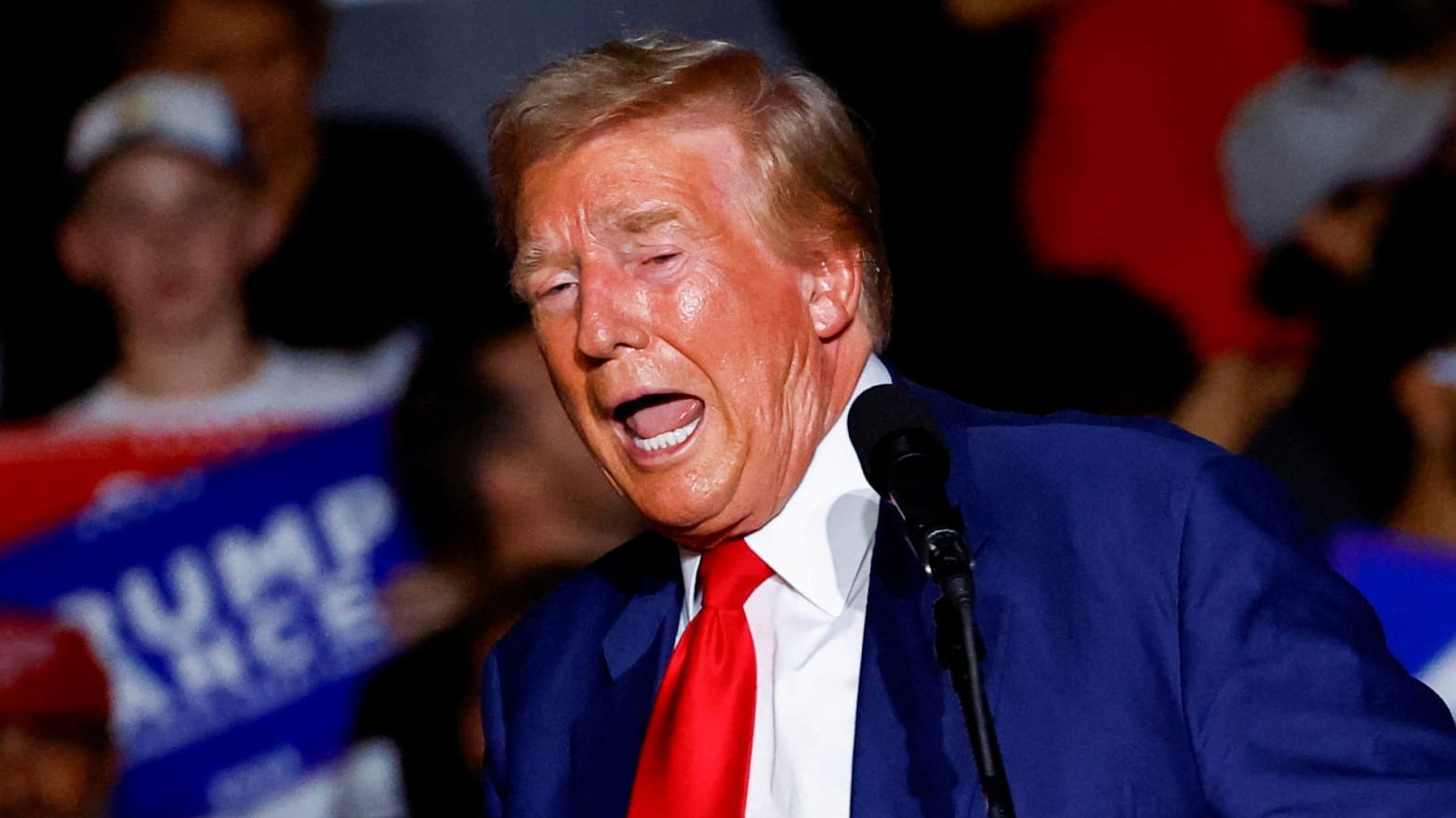 Donald Trump speaks on stage during a campaign rally.