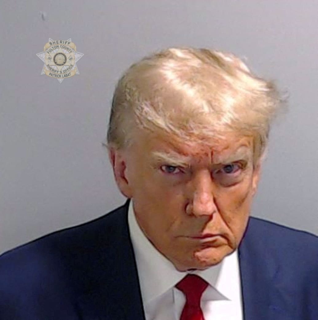 Former President Donald Trump is shown in a police booking mugshot released by the Fulton County Sheriff's Office.