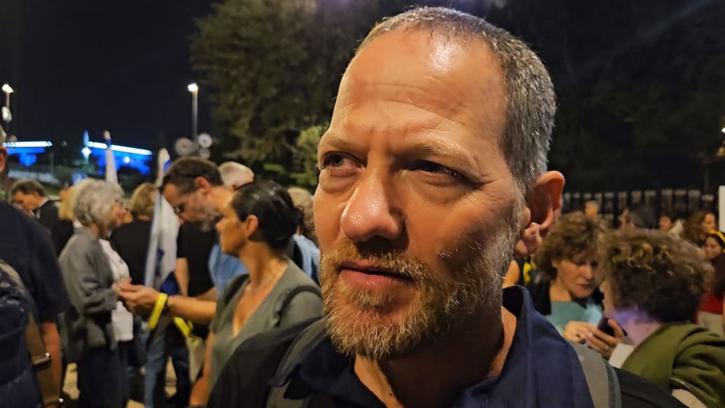 A photograph of Maoz Inon, an Israeli businessman and peace activist, outside the Knesset.