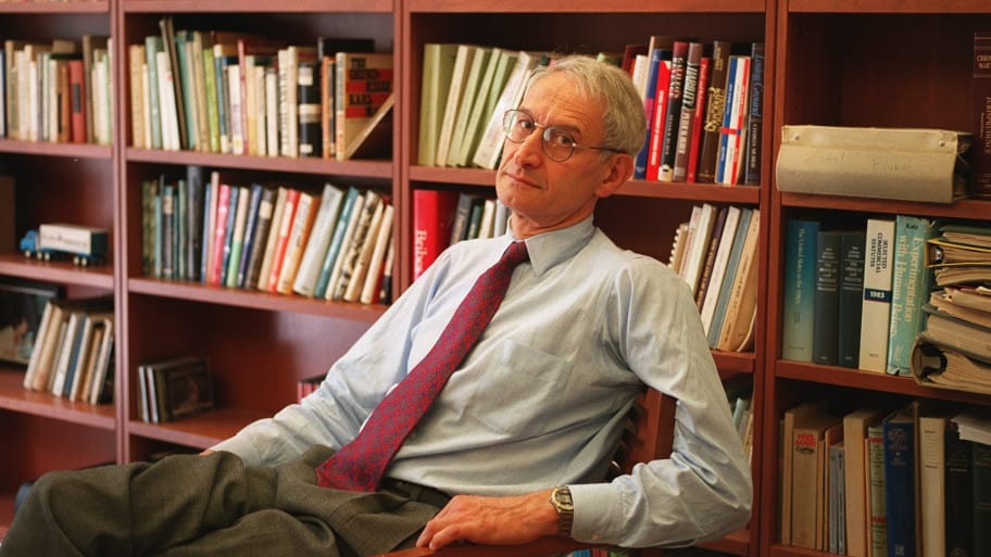 At his office at Harvard Law School, Charles Fried, nominee for the Supreme Judicial Court poses in front of his books.