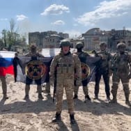 Yevgeny Prigozhin makes a statement as he stands next to Wagner fighters in Bakhmut, Ukraine, May 20, 2023. 