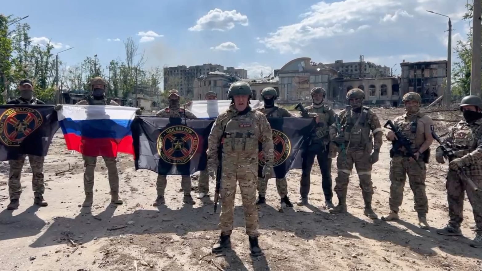 Yevgeny Prigozhin makes a statement as he stands next to Wagner fighters in Bakhmut, Ukraine, May 20, 2023. 