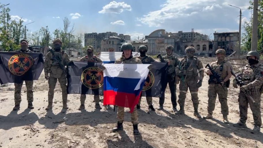 Yevgeny Prigozhin makes a statement as he stands next to Wagner fighters in Bakhmut, Ukraine, in this still image taken from video released May 20, 2023. 