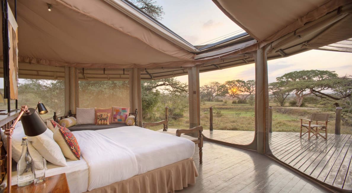 A photograph of hotel room tent overlooking the safari landscape at Basecamp in the Naboisho Conservancy, Kenya.
