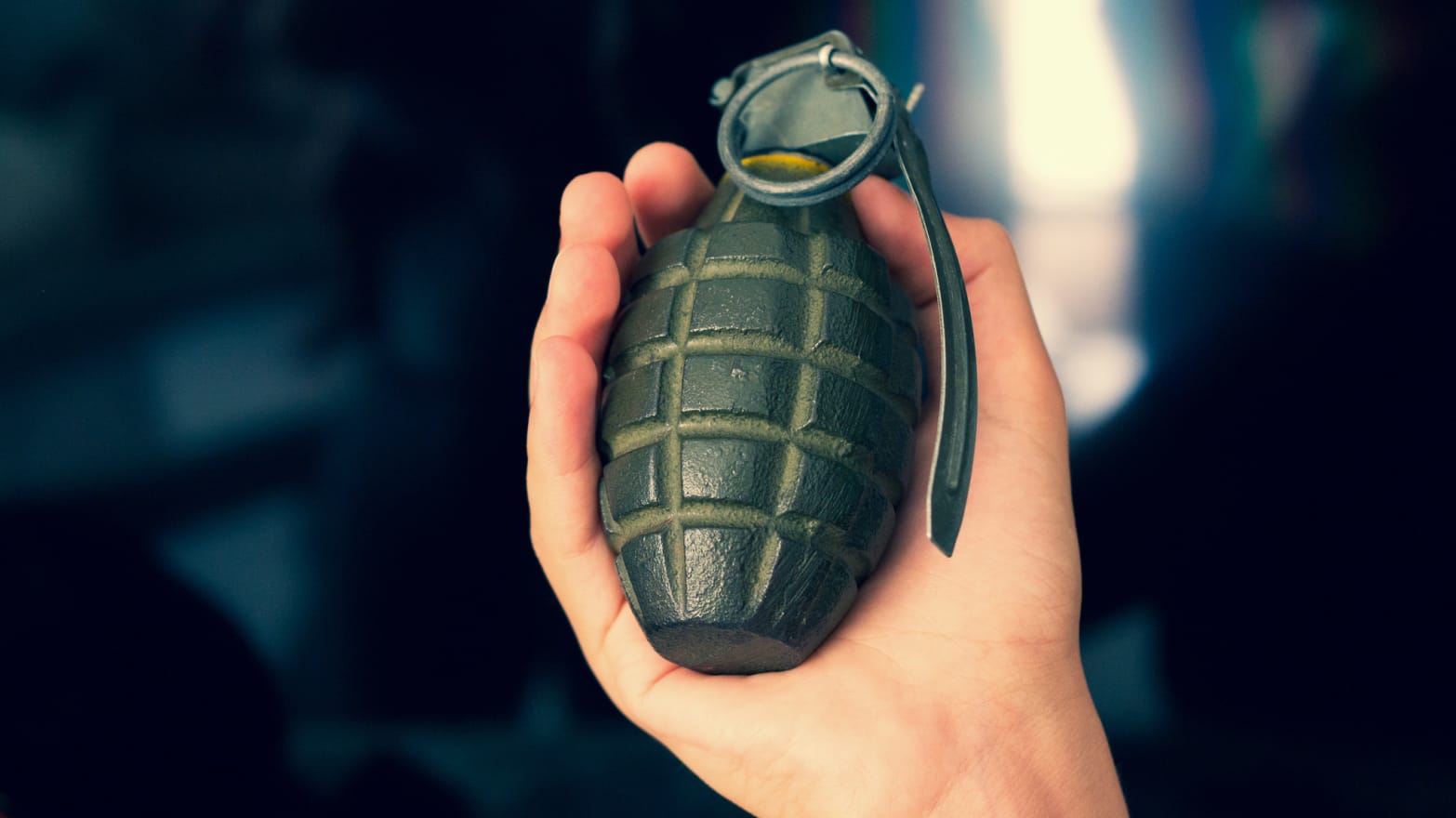 Hand grenade and black background.