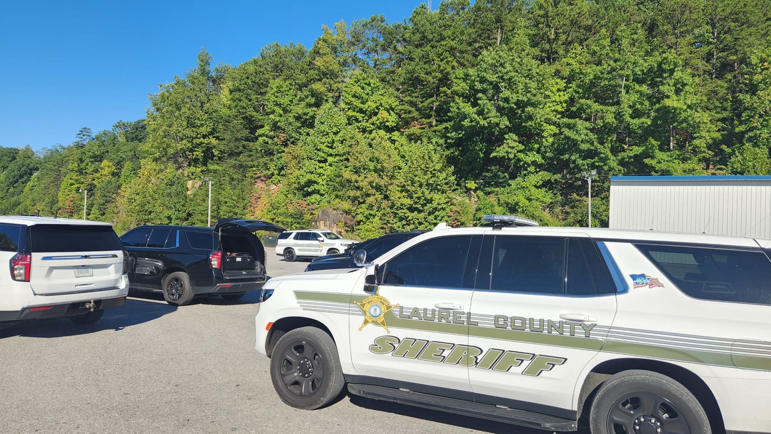 An image of Laurel County Sheriff's Office vehicles following a highway shooting in Kentucky.