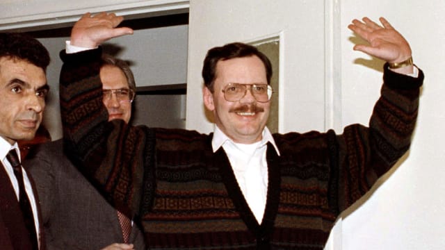 Terry Anderson celebrates with his hands raised after he was freed from being a hostage in Lebanon.