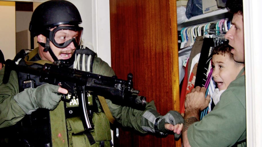 U.S. federal agents seize Cuban boy Elian Gonzalez from the home of his Miami relatives.