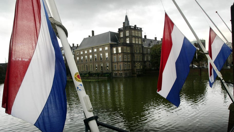 Flags hang at half mast in front of the Dutch Parliament in the Hague the day after the death of Prince Claus, the husband of Queen Beatrix, October 7, 2002.