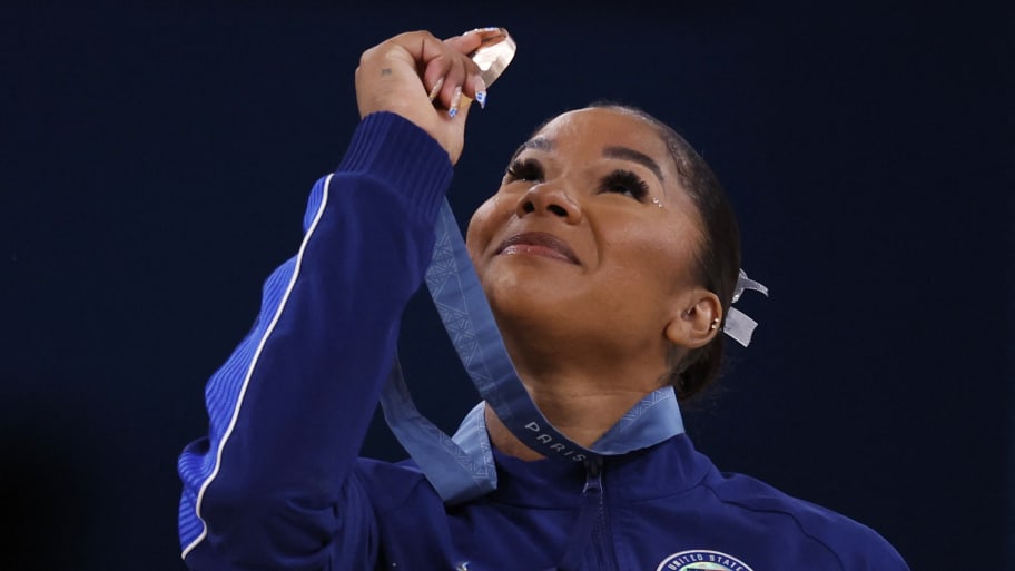 Bronze medallist Jordan Chiles of United States looks at her medal.