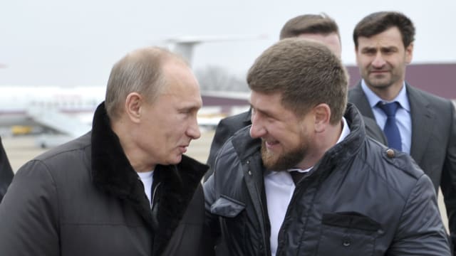 Russian Prime Minister Vladimir Putin laughing with Chechen leader Ramzan Kadyrov.