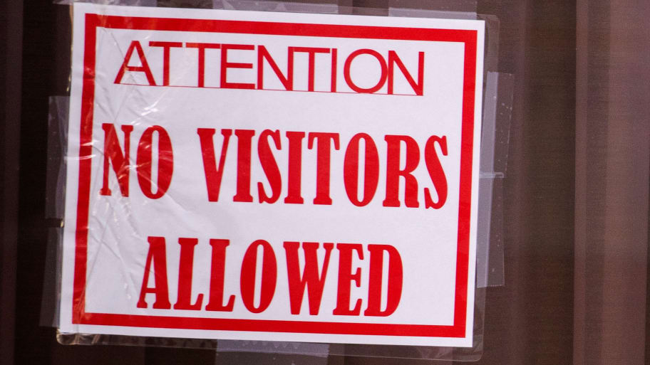 ‘No Visitors Allowed’ sign.