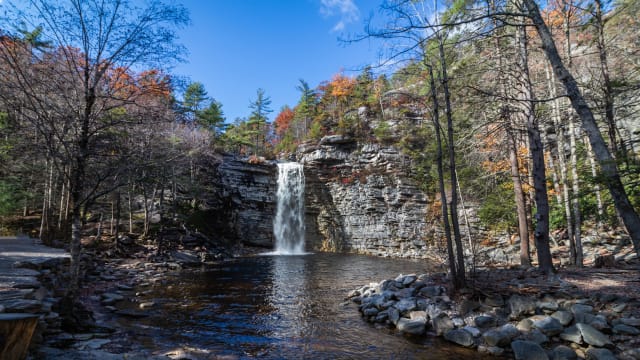 A scenic shot of a waterfall surrounded by a forest in Minnewaska State Park, NY, Kerhonkson, USA.
