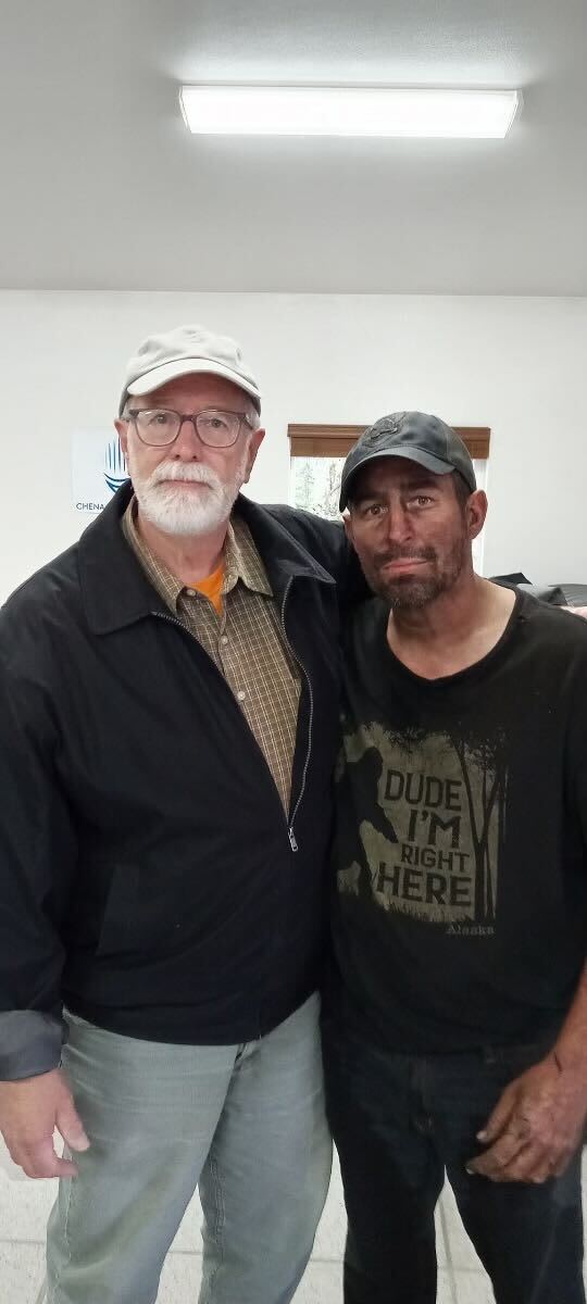 A photo of Jonas Bare and his father, following Bare’s rescue on Friday.