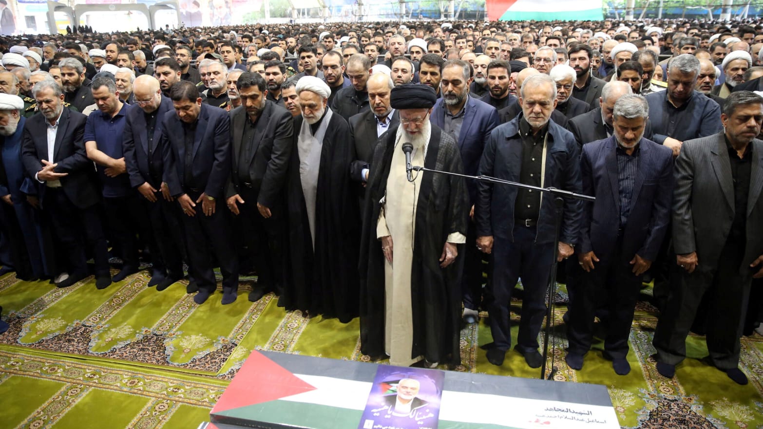 Iran's Supreme Leader Ayatollah Ali Khamenei among a crowd of nearly 10,000 people, performs prayer at the funeral of assassinated Hamas chief, Ismail Haniyeh.