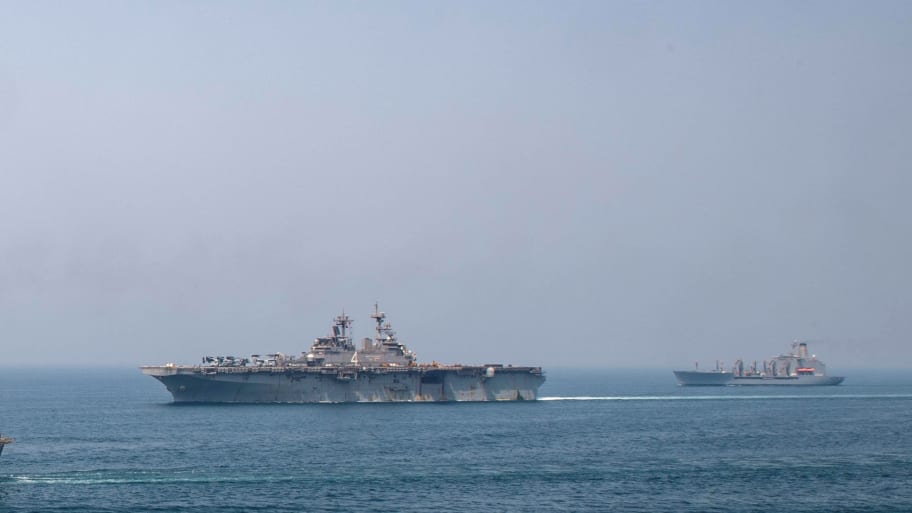 Fleet replenishment oiler USNS Big Horn (L), amphibious assault ship USS Boxer (C), and fleet replenishment oiler USNS Tippecanoe transit the Arabian Gulf.