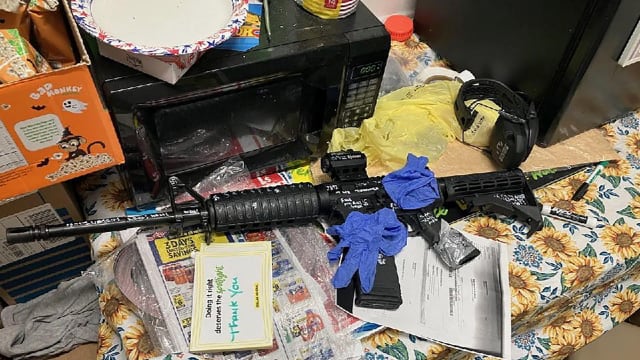 A rifle from the scene of a shooting at a Dollar General store in Jacksonville, Florida. Police say the gunman targeted Black people in a racist slaying that took 3 lives.