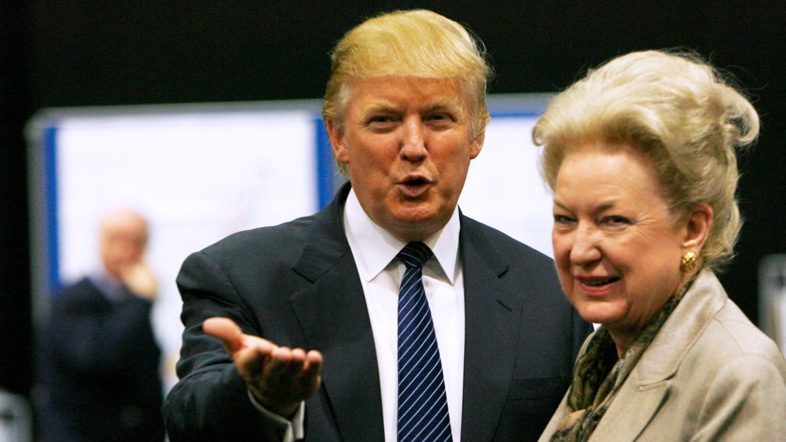 Donald Trump gestures as he stands next to his sister Maryanne Trump Barry.
