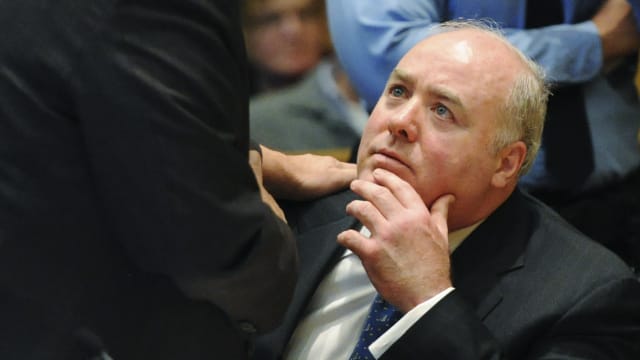 Michael Skakel, wearing jacket and tie, looks up during a 2013 bail hearing.