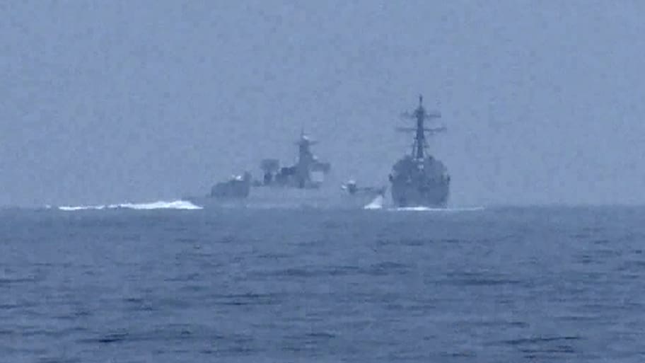 A People's Republic of China (PRC) warship, identified by the U.S. Indo-Pacific Command as PRC LY 132, crosses the path of U.S. Navy destroyer USS Chung-Hoon as it was transiting the Taiwan Strait
