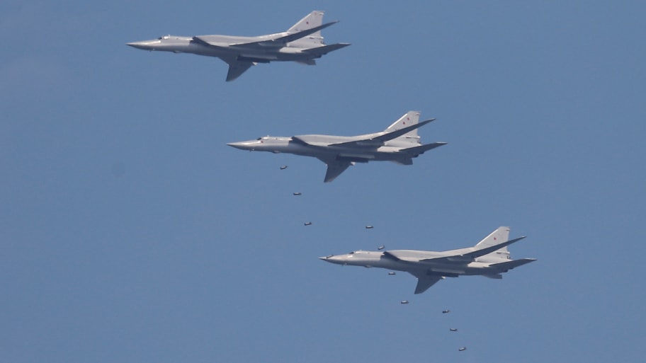 Tupolev Tu-22 M3 strategic bombers drop bombs during the Aviadarts competition, as part of the International Army Games 2018, at the Dubrovichi range outside Ryazan, Russia, August 4, 2018.
