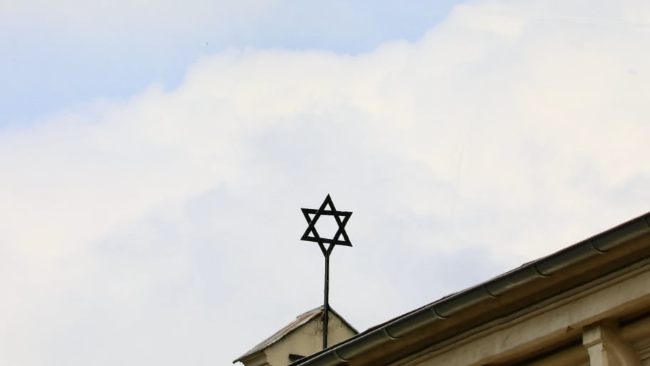 A Star of David is pictured atop a synagogue.