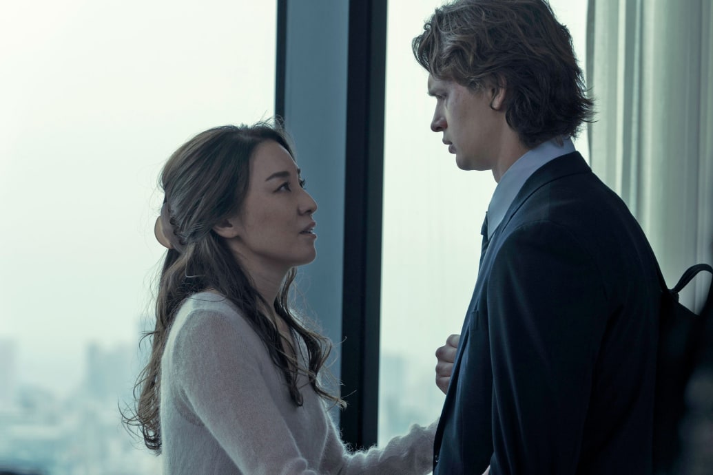 Ayumi Ito and Ansel Elgort look at each other in a still from 'Tokyo Vice'