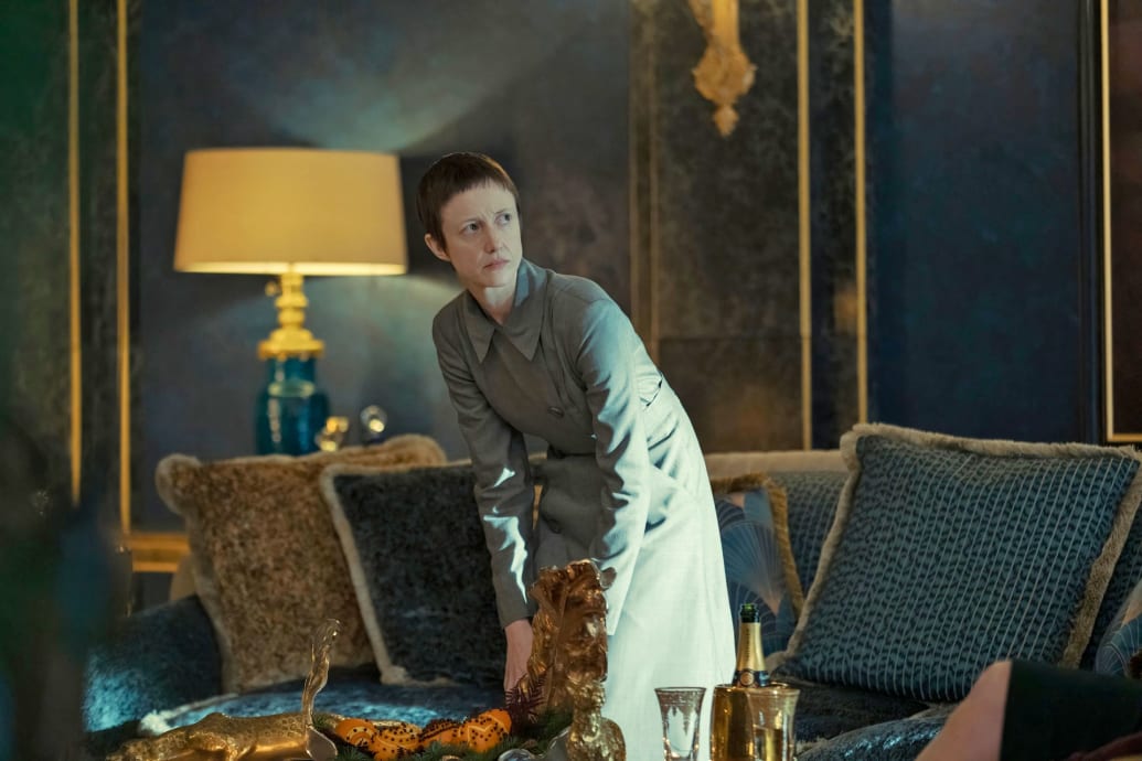Andrea Riseborough stands in a still from 'The Regime'