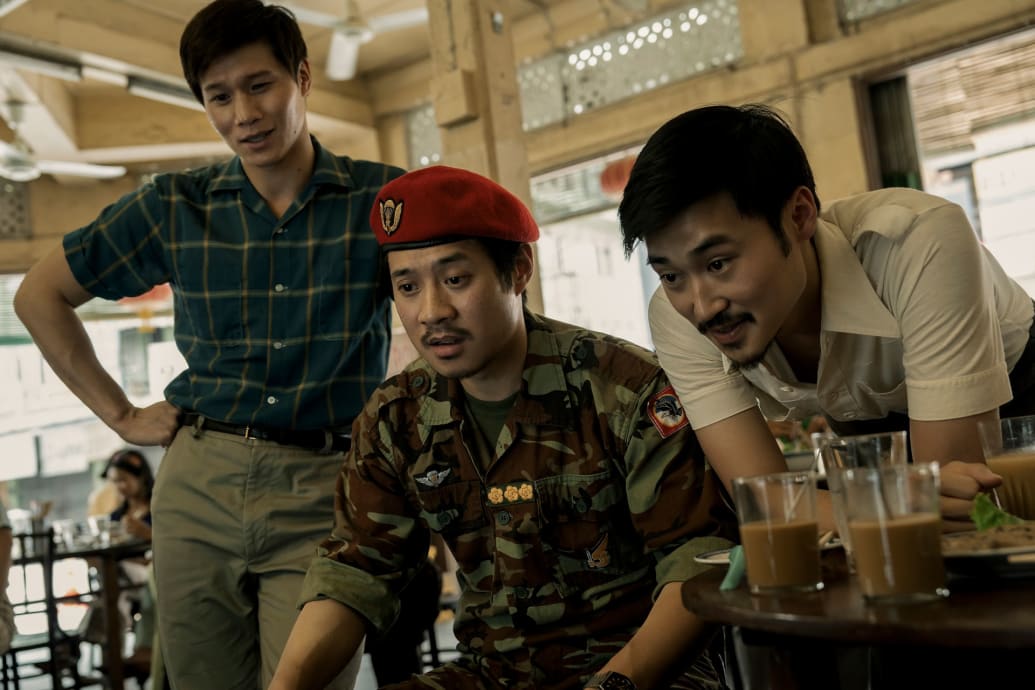 A still showing Hoa Xuande, Fred Nguyen Khan, and Duy Nguyen in The Sympathizer.