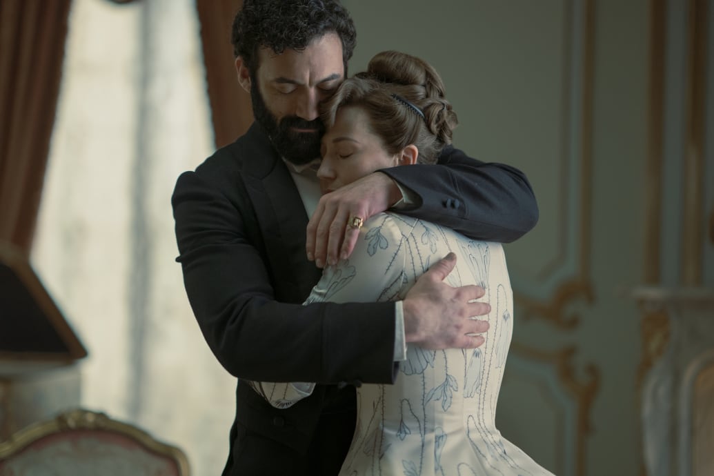 Photo still of Morgan Spector and Carrie Coon in "The Gilded Age"