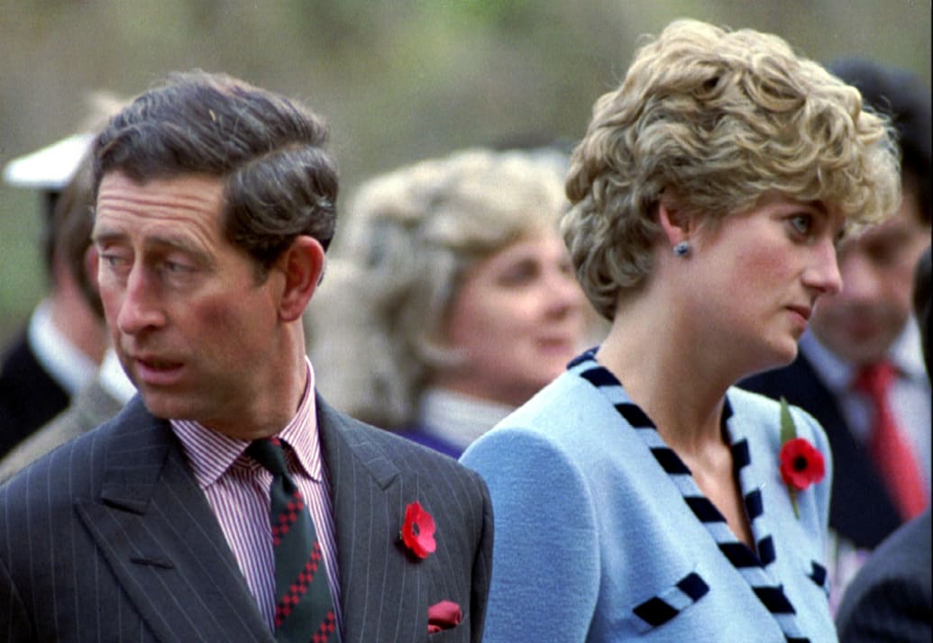 Princess Diana and Prince Charles look in different directions during a service held to commemorate the 59 British soldiers killed in action during the Korean War, Nov. 3, 1992.