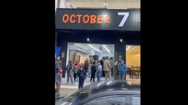A screenshot of footage showing a new restaurant called "October 7" in Jordan. 