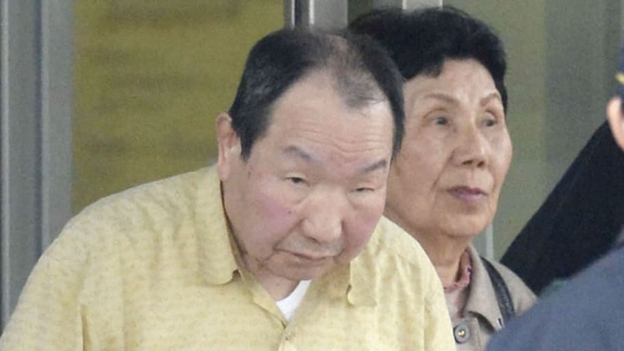 Iwao Hakamada (L), flanked by his sister Hideko, is released from Tokyo Detention House in Tokyo, in this photo taken by Kyodo, March 27, 2014. 