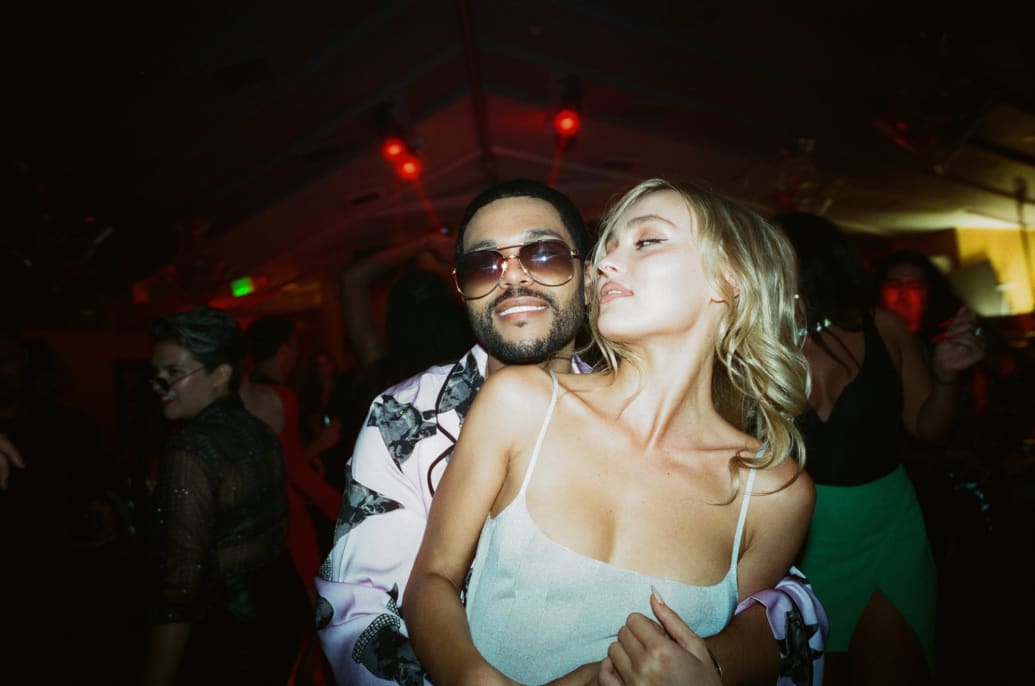 Abel "The Weeknd" Tesfaye and Lily-Rose Depp embrace during a scene from The Idol.