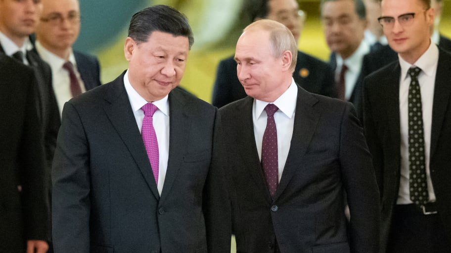 Chinese President Xi Jinping and Russian President Vladimir Putin walk during their meeting at the Kremlin in Moscow, Russia, June 5, 2019. 