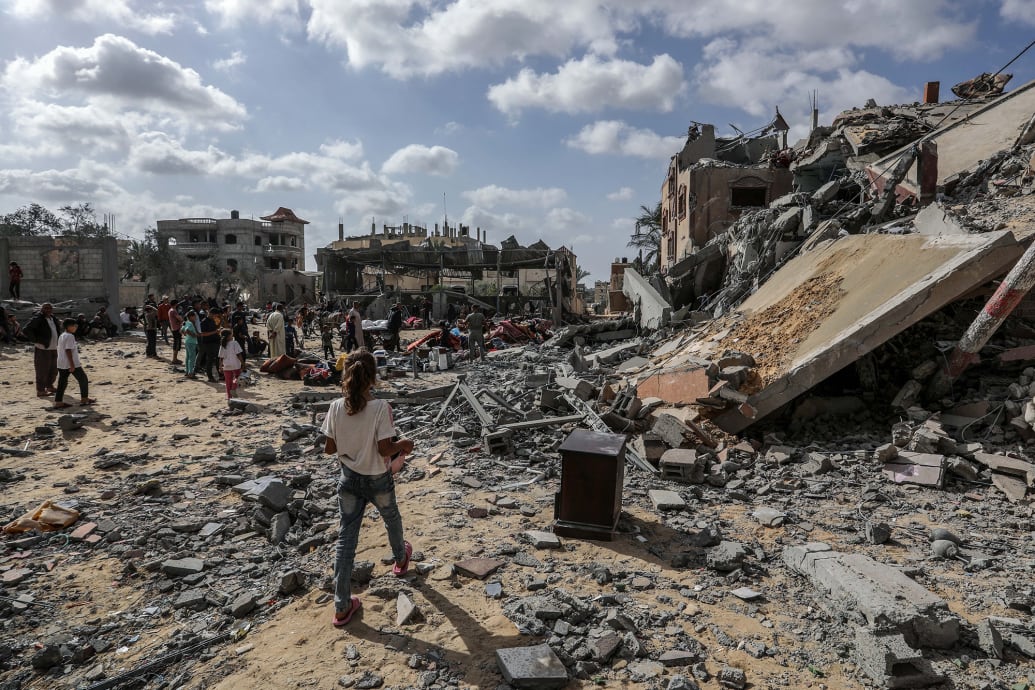Palestinians inspect damaged houses after Israeli warplanes bombed homes in Rafah, southern Gaza.