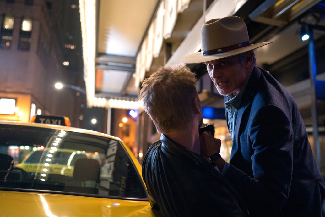 Boyd Holbrook and Timothy Olyphant fight in a scene from Justified: City Primeval.