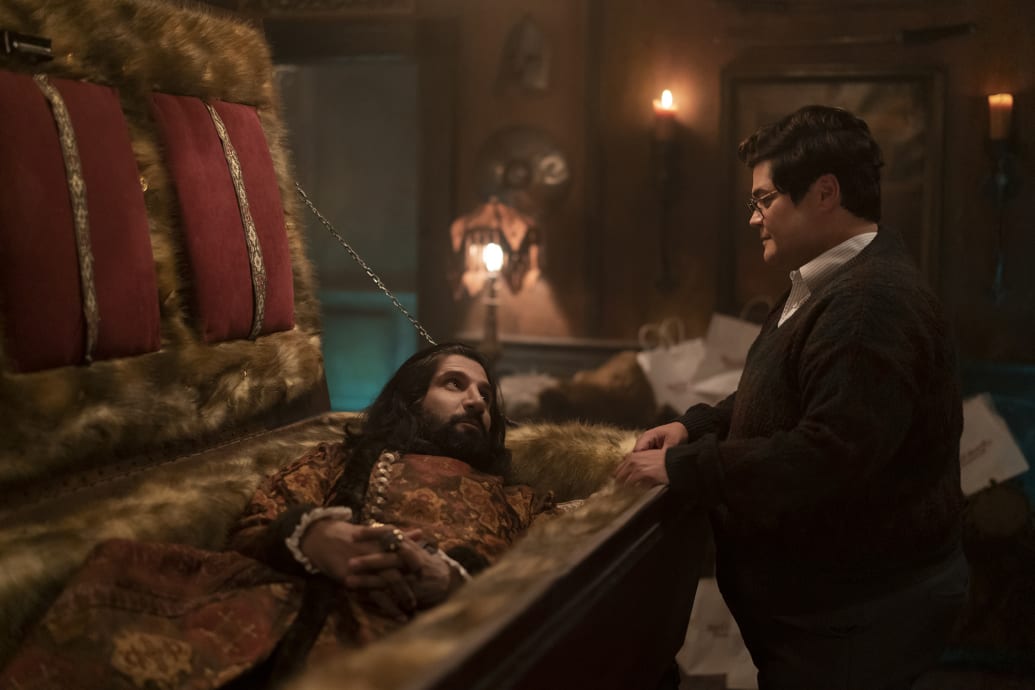 Image of Kayvan Novak and Harvey Guillén talking in What We Do in the Shadows.